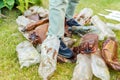 View of male feet trampling a bunch of plastic bottles/Concept ecology. View of male feet trampling a bunch of plastic bottles