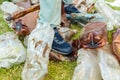 View of male feet trampling a bunch of plastic bottles/Concept ecology. View of male feet trampling a bunch of plastic bottles