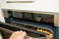 View of a male hand opening the oven Royalty Free Stock Photo