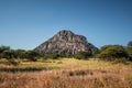 A view of the male hill at Tsodilo Hills, a UNESCO world heritage site featuring ancient San rock paintings. Pictured amid grassy Royalty Free Stock Photo