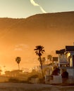 Hazy golden sunset on Malibu beach, California.