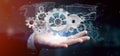 Man holding a technology gear wheel interface3d rendering Royalty Free Stock Photo