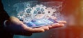 Man holding a technology gear wheel interface3d rendering Royalty Free Stock Photo