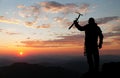 View of man on mountains with ice axe in hand Royalty Free Stock Photo