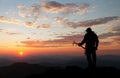 View of man on mountains with ice axe in hand Royalty Free Stock Photo