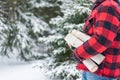 3/4 view of man in red plaid jacket carrying firewood Royalty Free Stock Photo