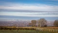 View of Manchester city with hazy winter sky, from Werneth Low Country Park on the borders of Stockport and Tameside,  Greater Royalty Free Stock Photo