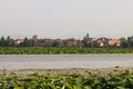 View of the Mantova skyline in Italy as viewed from the upper lake on a cloudy day