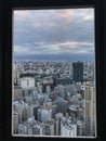 View of many modern buildings from the window frame of a high tower in Tokyo, Japan Royalty Free Stock Photo