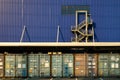 View of many shipping containers doors with fire escape background