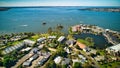 View of many watercraft on Lake Mulwala near the resort houses on the shore of the lake