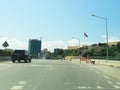 View of marginal Luanda road in the Luanda city downtown center with road, vehicles, people and buildings