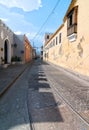 View of Mariano Corona street with locals and old tramway rails Royalty Free Stock Photo