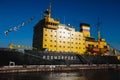 View of a Massive russian nuclear-powered icebreaker, diesel-powered ice-breaker ship in a port harbor, summer sunny day