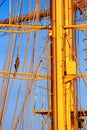 View of the masts and rigging of a sailing ship close-up against the background of sky Royalty Free Stock Photo