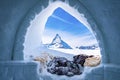 View of Matterhorn peak seen through ice igloo on snowy landscape Royalty Free Stock Photo