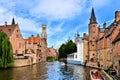 Medieval canals of Bruges, Belgium with bell tower Royalty Free Stock Photo