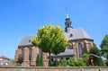 View on medieval church Sint Nicolaaskerk in small dutch village against blue summer sky