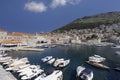 View of the medieval Old Port by Adriatic Sea with moored ships and City Walls, Dubrovnik, Croatia Royalty Free Stock Photo