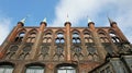 View of the medieval old town hall or Lubecker Rathaus, blue sky, beautiful architecture, Lubeck, Germany Royalty Free Stock Photo