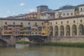 View of medieval stone bridge Ponte Vecchio and the Arno River from the Ponte Santa Trinita Holy Trinity Bridge in Florence, Royalty Free Stock Photo