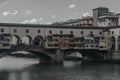 View of medieval stone bridge Ponte Vecchio and the Arno River from the Ponte Santa Trinita Holy Trinity Bridge in Florence, Royalty Free Stock Photo