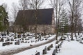 View of the medieval, stone Church, Hollolan Kirkko, with cemetery, Hollola, Finland.