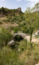 Sant Angelo in Fasanella Italy. View of the medieval stone humpback bridge over the sources of Auso. Ancient communication route Royalty Free Stock Photo