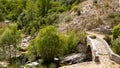 Sant Angelo in Fasanella Italy. View of the medieval stone humpback bridge over the sources of Auso. Ancient communication route Royalty Free Stock Photo