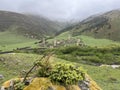View of the medieval Targim tower complex in the Caucasus mountains surrounded by greenery. The Caucasus Mountains on a Royalty Free Stock Photo