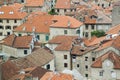 view of medieval tiled roofs of stone houses with windows and wo