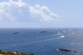 Pleasure boats leave Eivissa port in Ibiza, trailing white wakes under cloudy skies Royalty Free Stock Photo