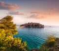 View in the Mediterranean sea and Sveti Stefan at sunset. Montenegro.