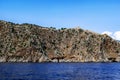 View from the Mediterranean Sea to the mountain with the ancient stone wall of the Alanya Castle on the peak Turkey. Desert rock Royalty Free Stock Photo