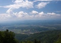 View from Medvednica, Sljeme mountain in Zagreb, Croatia. Landscape photo with blue sky, white clouds and green trees Royalty Free Stock Photo