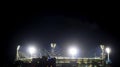 View of Melbourne cricket ground stadium lights during a footy game at night in Melbourne