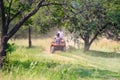 View of men Quad biking on a sunny day in the African bush