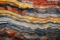 View the mesmerizing array of colors on a single rock, showcasing the diverse beauty of nature., A rough texture of layered colors