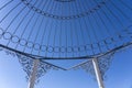 View on metal gazebo above blue sky on sunny summer day, closeup