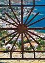 View through a metal railing on a window to Leros island, Dodecanese, Greece Royalty Free Stock Photo