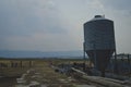 The metal silo on the old rusty farm Royalty Free Stock Photo