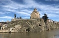 View of Metekhi Church and chapel of st. Abo Tbileli with monument of King Vakhtang I Gorgasali founder of the city Tbilisi,