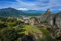 View from the Meteora rocks over the village Kalambaka in the valley to the mountains and snow-capped peaks, landscape in central