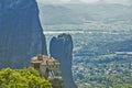 The view of Meteora with Holy Monastery of Roussanou sit precipitously on mountain rocky boulder at Thesally, Greece. Royalty Free Stock Photo