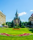 View of the metropolitan cathedral in romanian city timisoara with a statue of romulus, remus and a wolf in front of it Royalty Free Stock Photo
