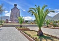 Monument of the Middle of the World and palm trees