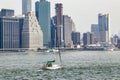 View of midtown Manhattan skyline and sailboat