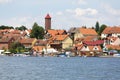 View from MikoÃâajskie Lake of town, marina for yachts and boats at the waterfront, Mikolajki, Masuria, Poland