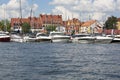View from MikoÃâajskie Lake of town, marina for yachts and boats at the waterfront, Mikolajki, Masuria, Poland Royalty Free Stock Photo