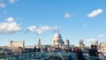 View of the Millennium bridge in London with St Paul cathedral and tourists walking Royalty Free Stock Photo